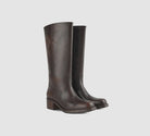Brown Miranda 14 tall Western-inspired boots featuring a sleek vegan leather finish, square toe, 2-inch stacked block heel, and pull-on design with internal pull loops for easy wear.