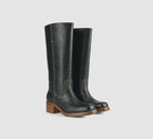 Black Miranda 14 tall Western-inspired boots featuring a sleek vegan leather finish, square toe, 2-inch stacked block heel, and pull-on design with internal pull loops for easy wear.