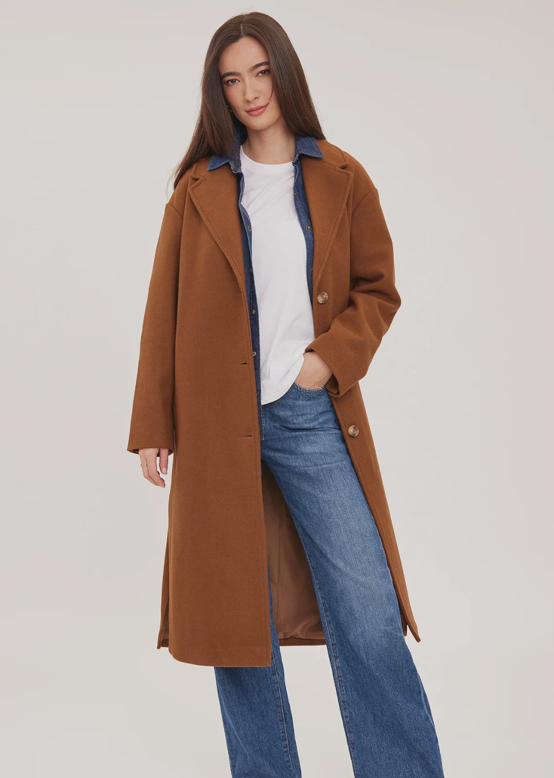 Agatha coat in soft, brushed melton fabric, featuring a front button closure, welt pockets, side slits, and a fully lined interior.