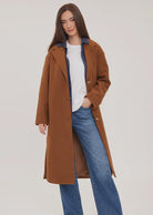 Agatha coat in soft, brushed melton fabric, featuring a front button closure, welt pockets, side slits, and a fully lined interior.