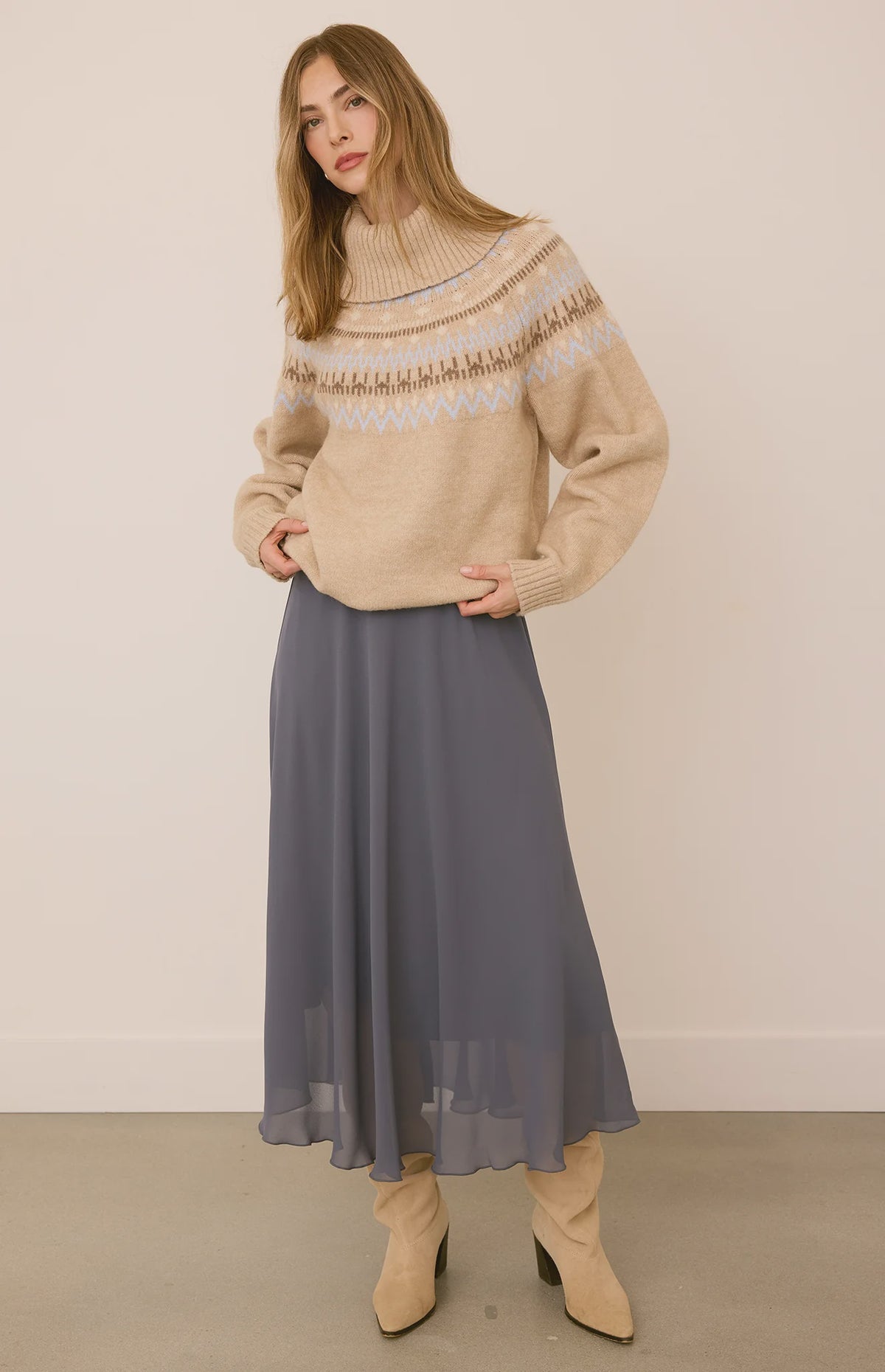 Arianna bias-cut chiffon skirt with a flattering high-rise fit, soft fluid drape, and an elastic waistband finished with delicate scalloped trim. Fully lined for comfortable wear and available in Smoke and Black.