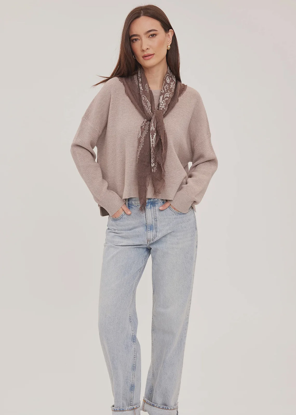 Axel oversized sweater in a soft waffle-knit yarn, featuring a crew neckline, exposed seam details, and side slits for a relaxed, textured look.