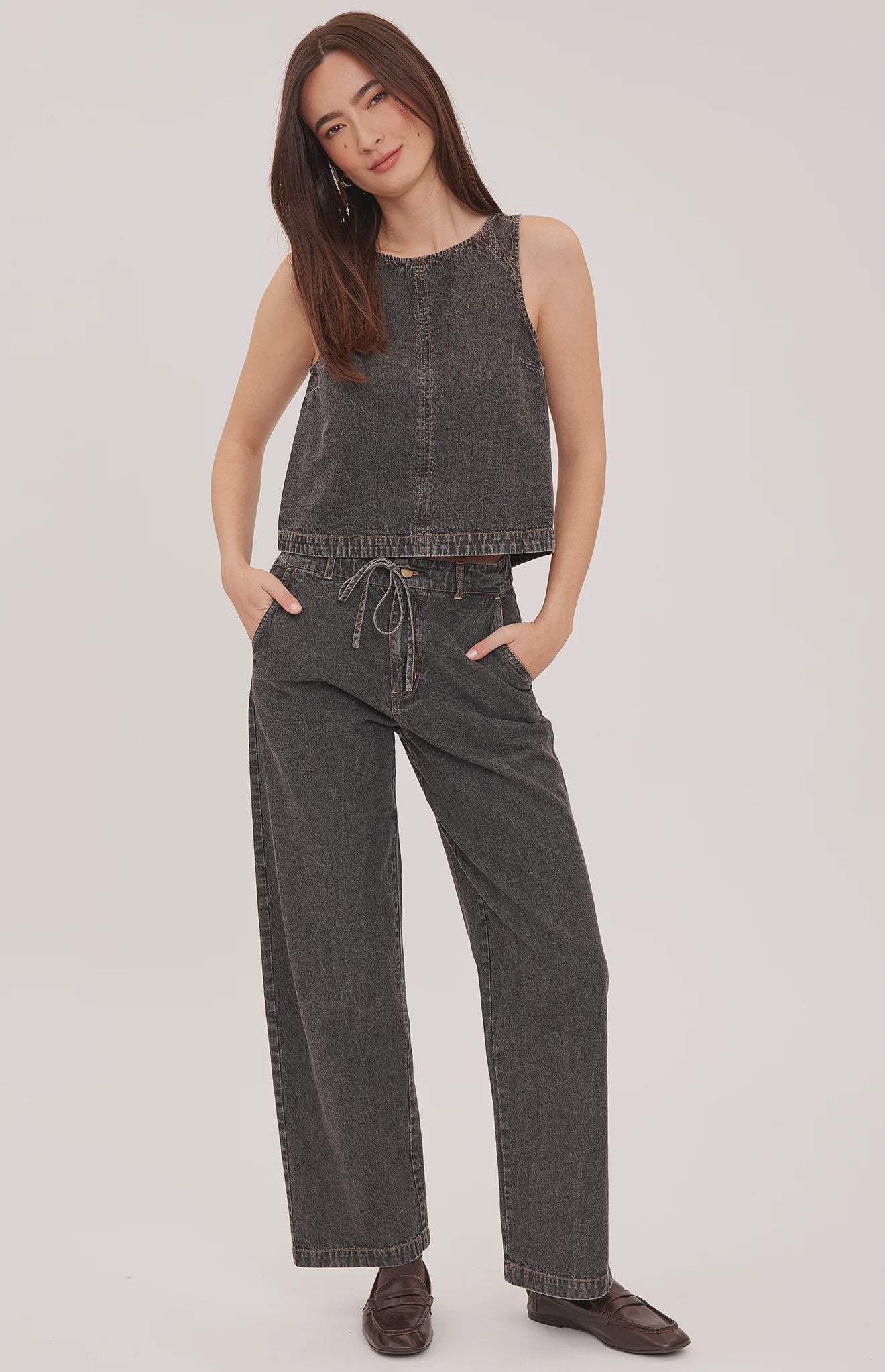 Blaise denim tank top with a lived-in wash, contrast topstitching details, and a back keyhole closure.
