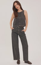 Blaise denim tank top with a lived-in wash, contrast topstitching details, and a back keyhole closure.