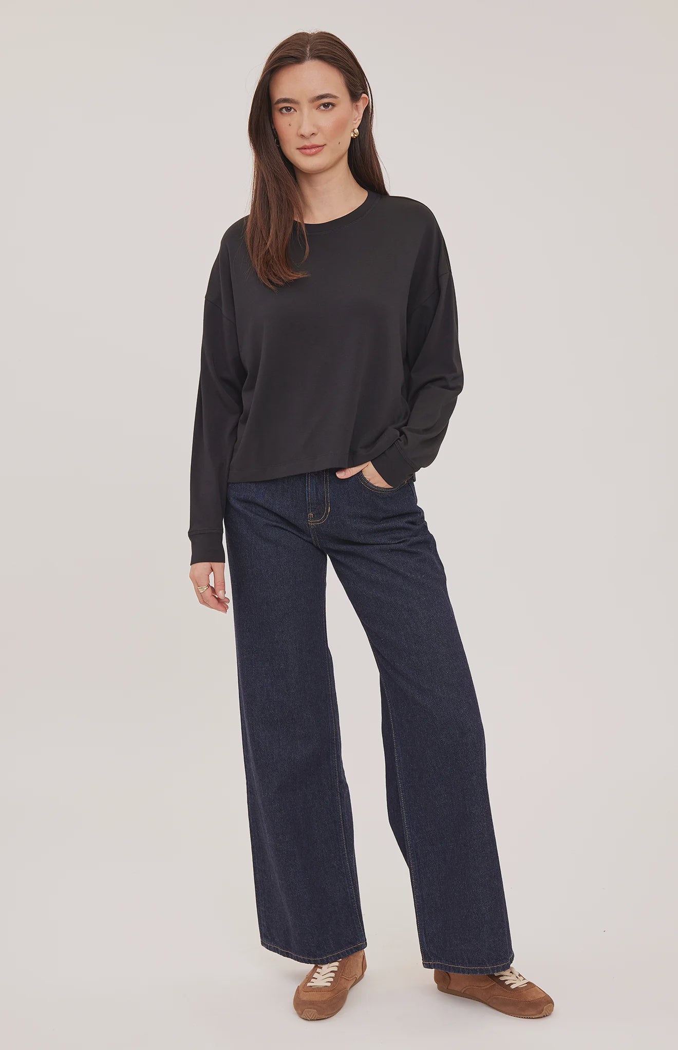 Easton top in a soft cotton-modal blend with a classic crew neckline, oversized fit, and side slit details for added movement. Available in Black and Cream.