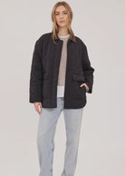 Felix relaxed-fit quilted jacket in brushed nylon, featuring a contrast corduroy collar and dual-entry pockets.