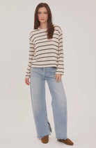 Women's relaxed long sleeve top featuring cream and soft beige stripes, a classic crew neckline, side slits, and a lightweight rayon jersey knit.