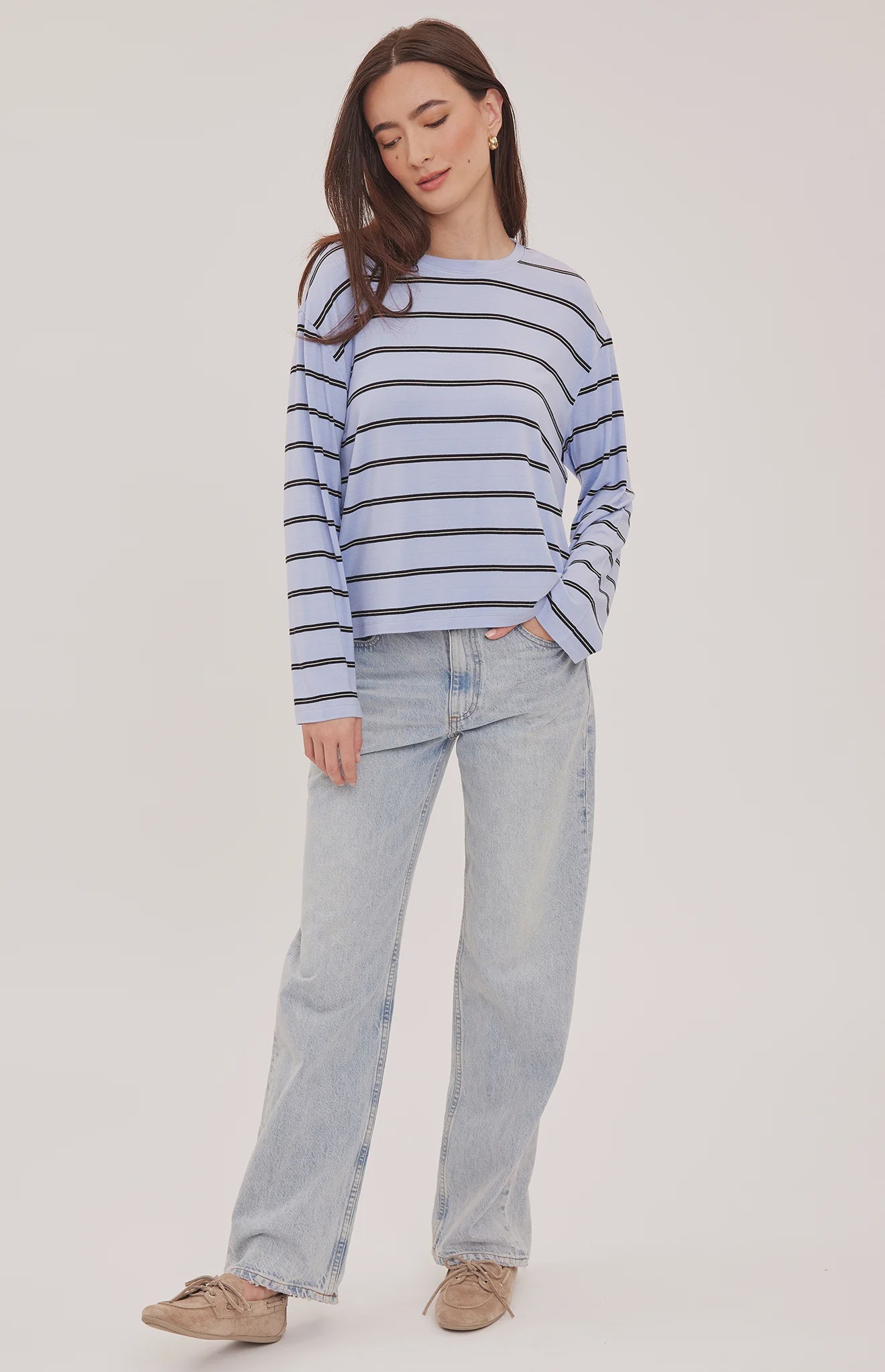 Women's relaxed long sleeve top with sky blue and white stripes, a crew neckline, side slits, and a soft rayon jersey fabric 