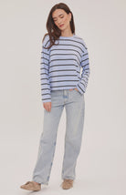 Women's relaxed long sleeve top with sky blue and white stripes, a crew neckline, side slits, and a soft rayon jersey fabric 