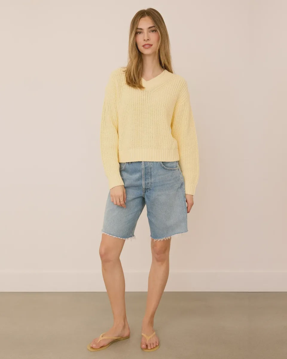 Woman wearing the Gentle Fawn Jocelyn Knit Sweater in Parchment, featuring a soft cotton blend knit, flattering V-neckline, and regular fit.