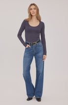 Lexy top in a stretchy ribbed fabric with a body-hugging contour fit, scoop neckline, and delicate scalloped edge for a feminine finish. Available in Black and Smoke.