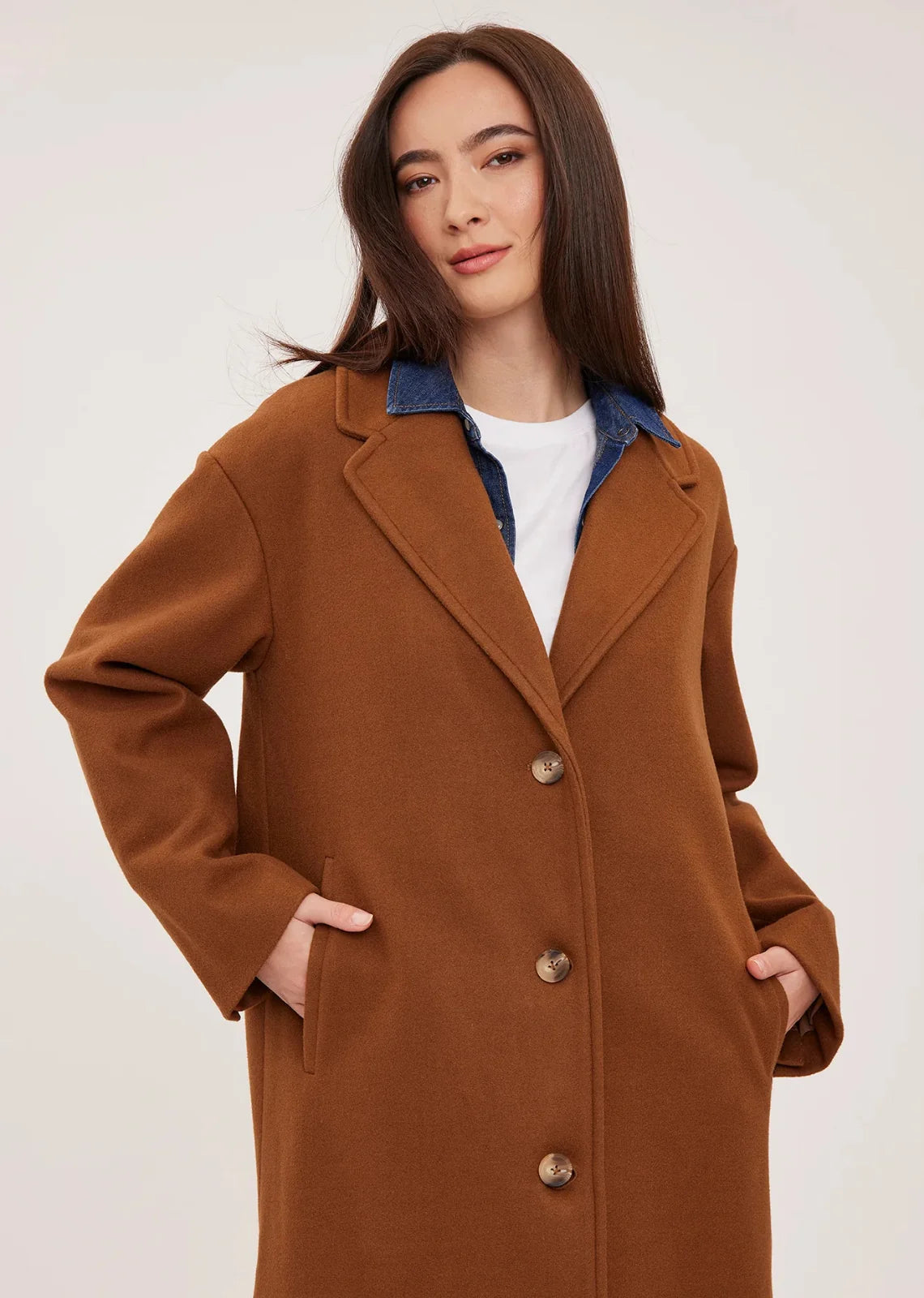 Agatha coat in soft, brushed melton fabric, featuring a front button closure, welt pockets, side slits, and a fully lined interior.