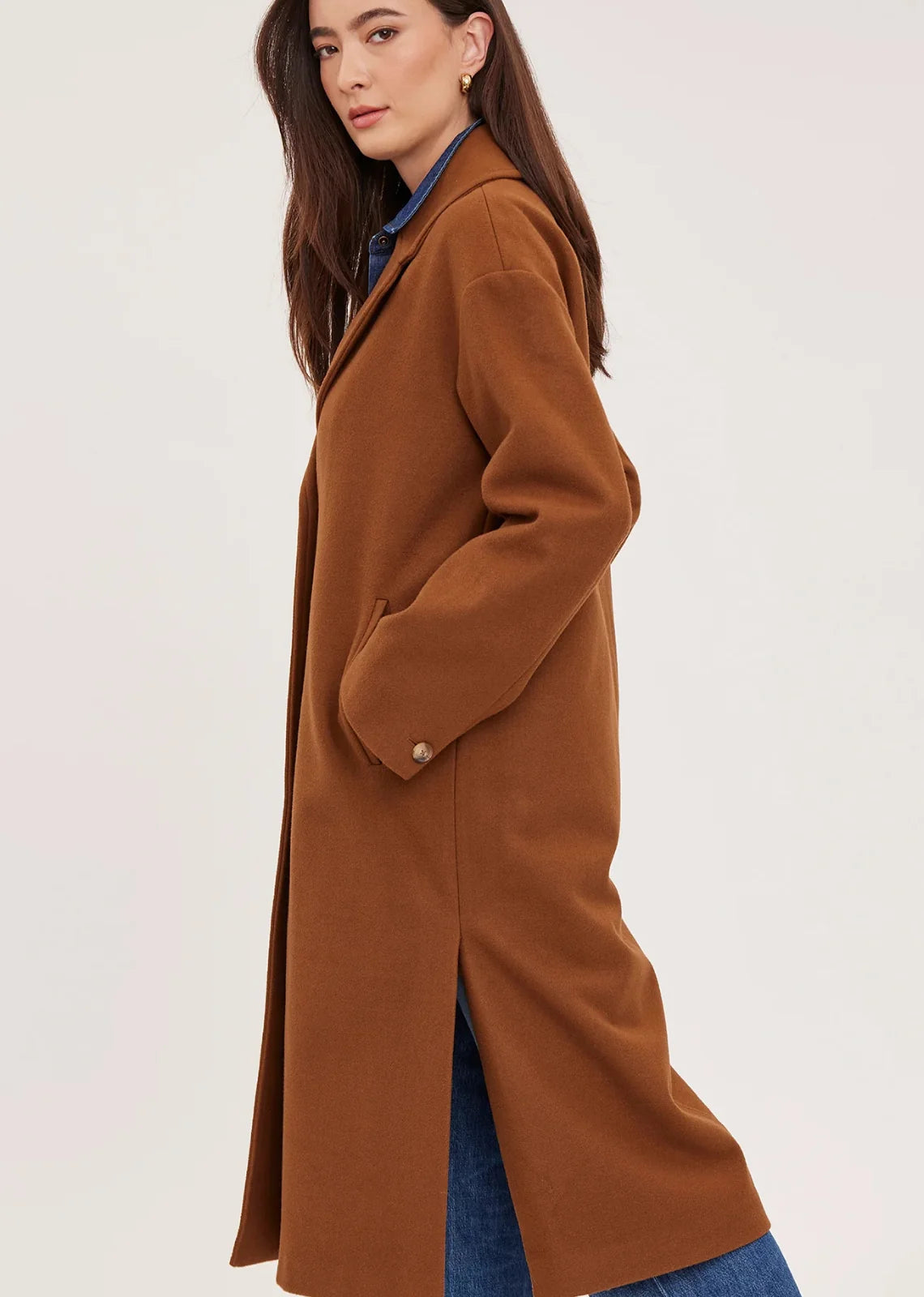 Agatha coat in soft, brushed melton fabric, featuring a front button closure, welt pockets, side slits, and a fully lined interior.