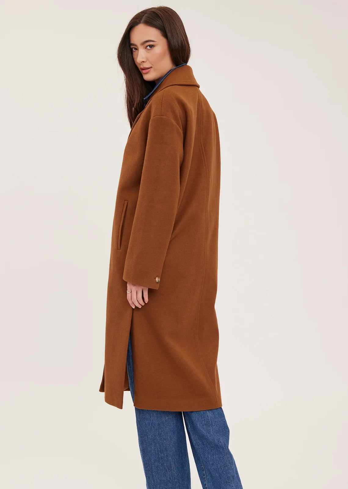 Agatha coat in soft, brushed melton fabric, featuring a front button closure, welt pockets, side slits, and a fully lined interior.