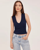 Women's navy blue ribbed cropped tank top featuring a V-neckline, wide straps, and a fitted cropped silhouette in a comfortable stretch ribbed knit.