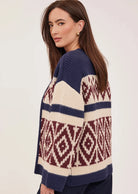 Dorian cardigan in soft, cozy yarn featuring a custom jacquard pattern and relaxed fit.
