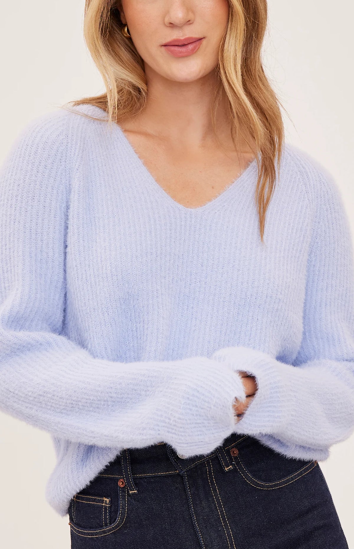 Filomena sweater in a soft, plush knit with a relaxed silhouette, flattering V-neckline, and raglan sleeves for an easy, laid-back fit. Available in Smoke and Skyline.