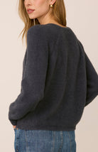 Filomena sweater in a soft, plush knit with a relaxed silhouette, flattering V-neckline, and raglan sleeves for an easy, laid-back fit. Available in Smoke and Skyline.