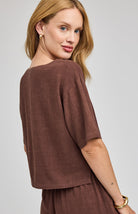 espresso coloured top in a lightweight rayon-linen blend featuring a boat neckline, side slits, and a relaxed, easy-to-style silhouette.