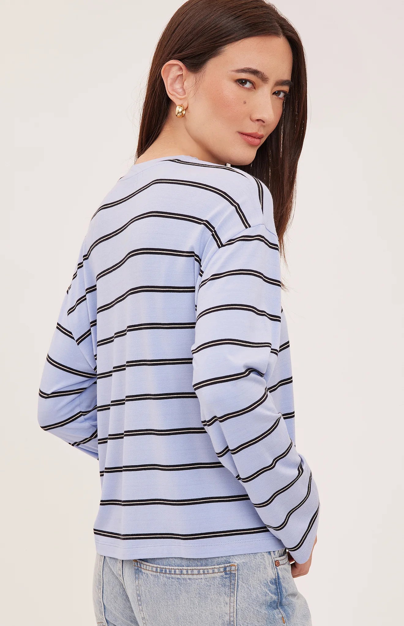 Women's relaxed long sleeve top with sky blue and white stripes, a crew neckline, side slits, and a soft rayon jersey fabric 