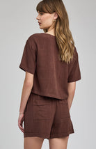 High-rise Juno shorts in a lightweight rayon-linen blend featuring an elastic drawstring waistband, front slash pockets, back patch pockets, and a relaxed fit.