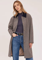 Millie relaxed-fit coat in brushed herringbone fabric, featuring a contrast corduroy collar, welt pockets, a back vent, and a fully lined interior.