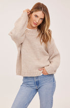 Tova sweater in a soft heathered knit with an oversized crew neckline, relaxed fit, and perfectly cropped length. Available in Heather Pebble and Heather Skyline.