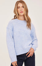 Tova sweater in a soft heathered knit with an oversized crew neckline, relaxed fit, and perfectly cropped length. Available in Heather Pebble and Heather Skyline.
