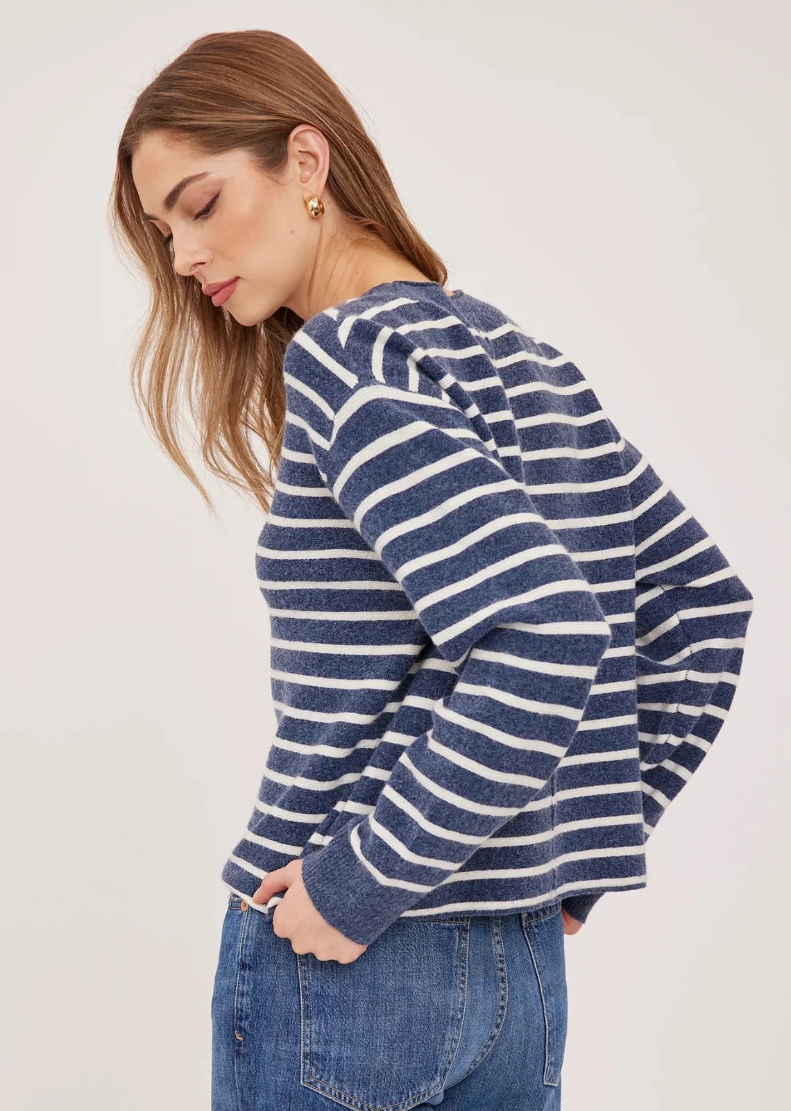 Wanda relaxed-fit sweater in navy with white stripes made from soft, brushed yarn, featuring rolled edges at the neckline and hem for an effortless, casual look.