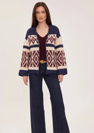 Dorian cardigan in soft, cozy yarn featuring a custom jacquard pattern and relaxed fit.