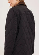 Felix relaxed-fit quilted jacket in brushed nylon, featuring a contrast corduroy collar and dual-entry pockets.