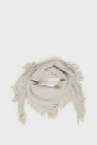 Soft cream triangle scarf with a lightly brushed texture, fringe trim, and versatile drape.
