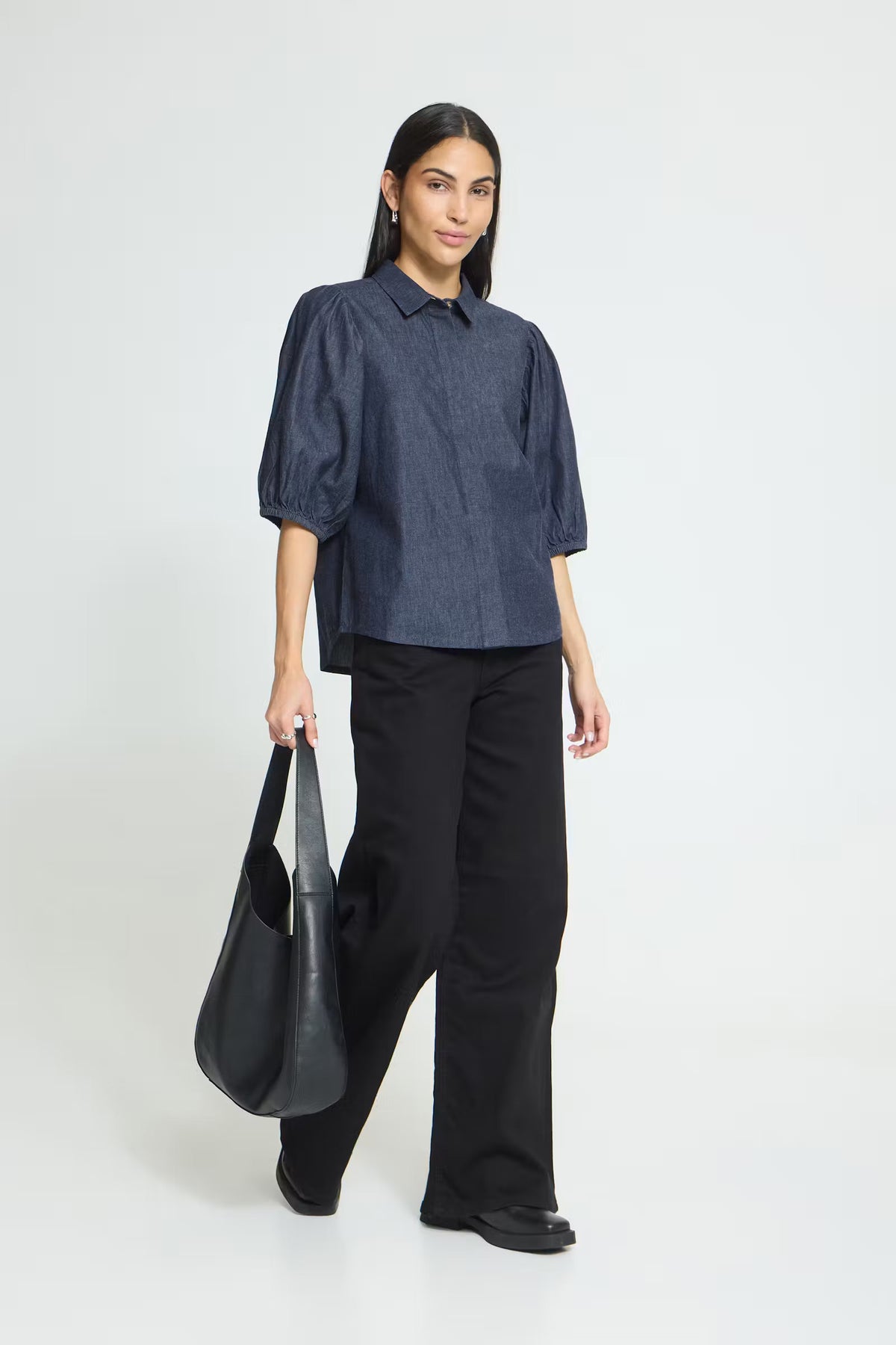 Washed dark blue cotton shirt featuring a straight silhouette, voluminous elbow-length sleeves, classic collar, concealed front button placket, and a soft textured finish for a relaxed yet polished look.