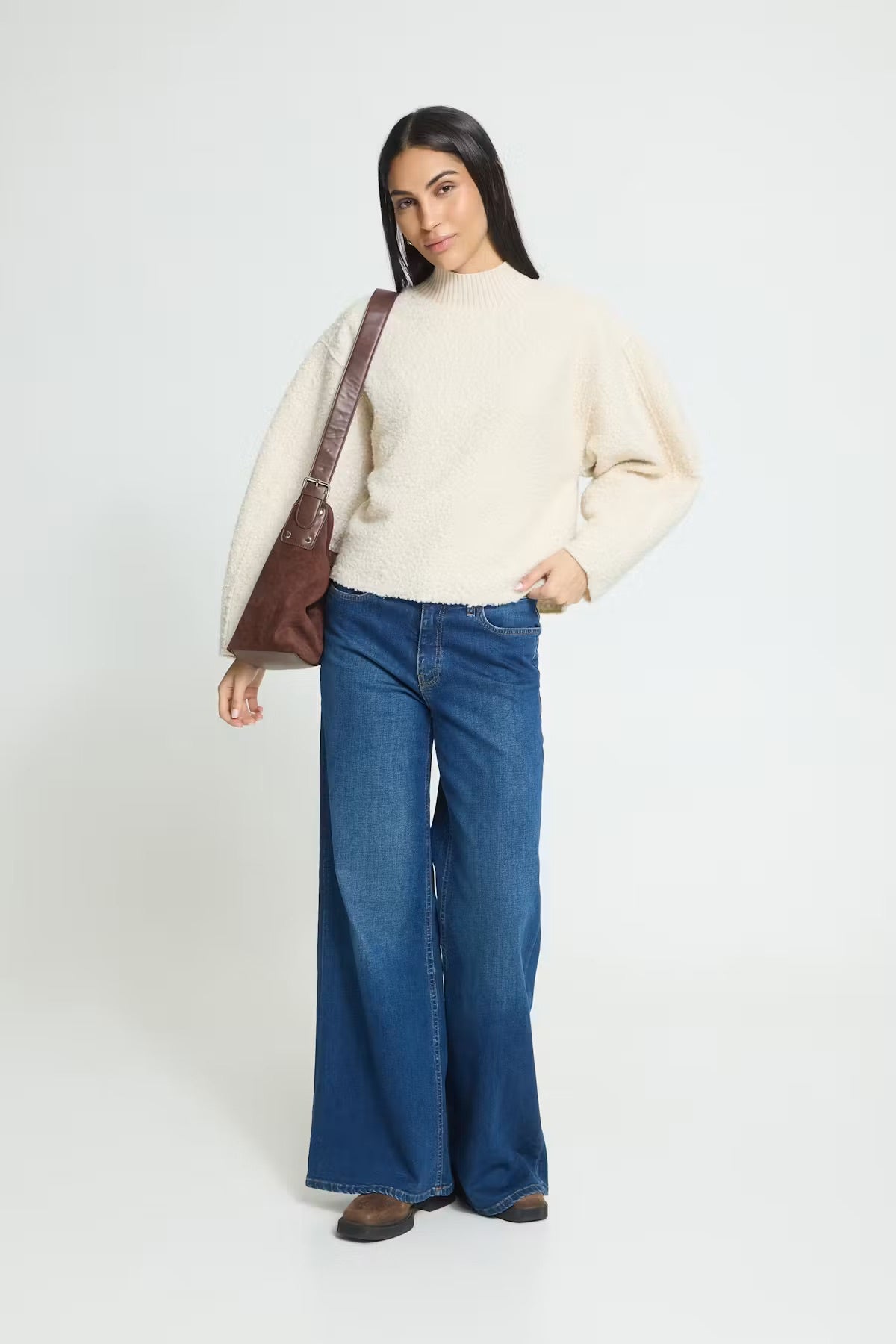 Teddy textured pullover with a soft, cozy finish, relaxed straight silhouette, ribbed mock neckline, and long sleeves for an easy everyday look.