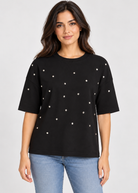 ICHI IHPETRO Shirt in Black/Silver Studs featuring a relaxed fit, classic crew neckline, dropped shoulders, and scattered silver stud embellishments across the front. Crafted from soft cotton with a solid black back for a casual yet edgy look.