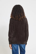 Knit cardigan in a light Cloud Dancer shade featuring a relaxed fit, long sleeves, and a button-front closure with a cozy textured finish.