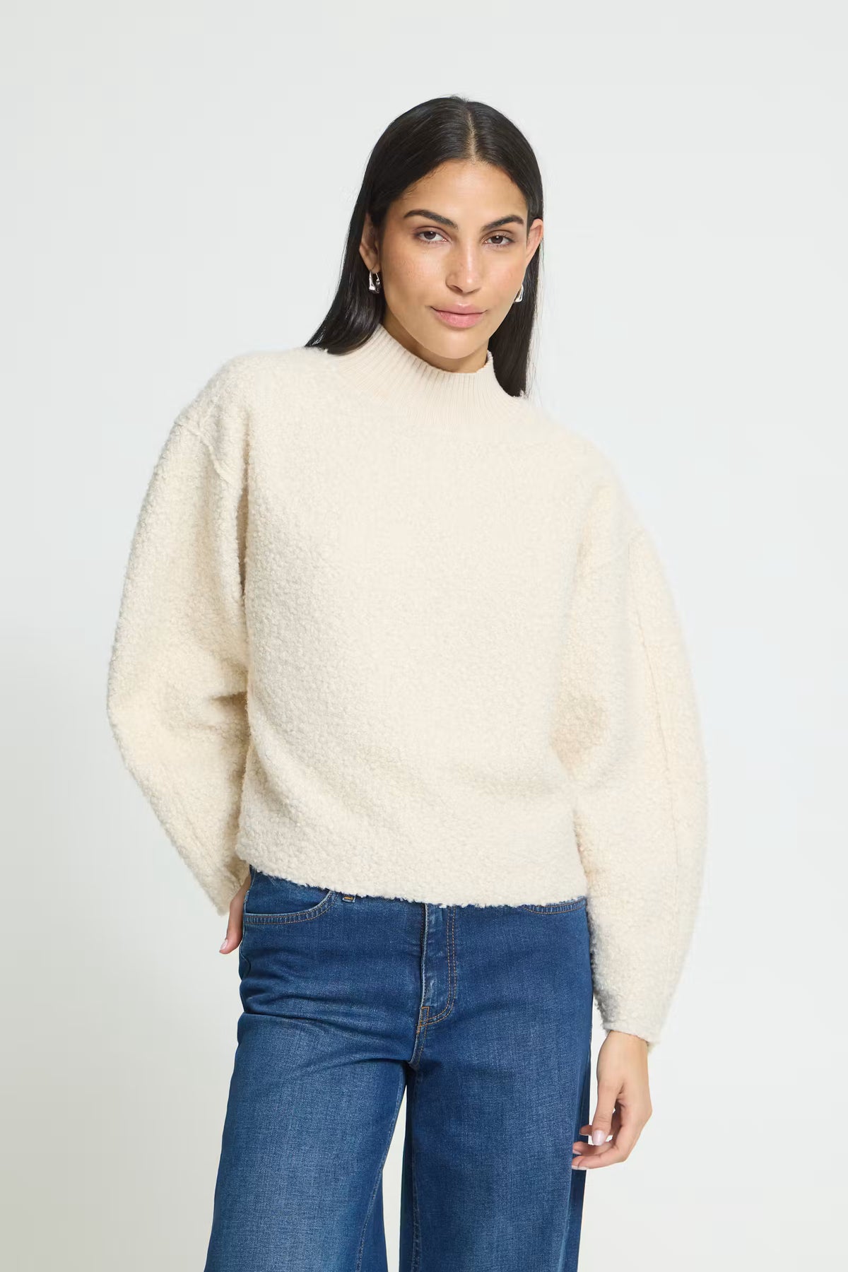 Teddy textured pullover with a soft, cozy finish, relaxed straight silhouette, ribbed mock neckline, and long sleeves for an easy everyday look.