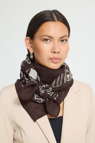 Scarf with a lightweight, soft finish and a visible large square shape. Classic frayed edges and bold contrasting motif along the border. Effortlessly elevates everyday style.