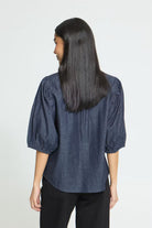 Washed dark blue cotton shirt featuring a straight silhouette, voluminous elbow-length sleeves, classic collar, concealed front button placket, and a soft textured finish for a relaxed yet polished look.