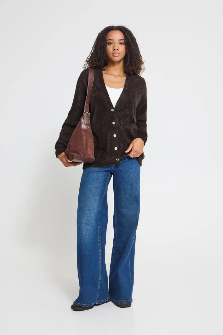 Knit cardigan in a light Cloud Dancer shade featuring a relaxed fit, long sleeves, and a button-front closure with a cozy textured finish.