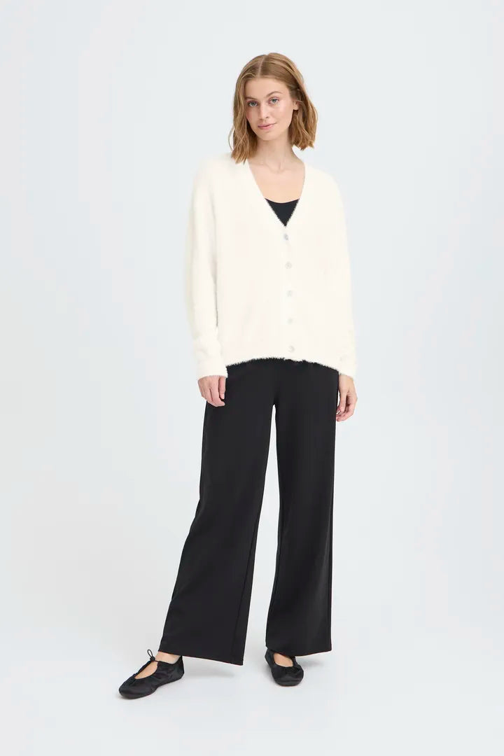 Knit cardigan in a light Cloud Dancer shade featuring a relaxed fit, long sleeves, and a button-front closure with a cozy textured finish.