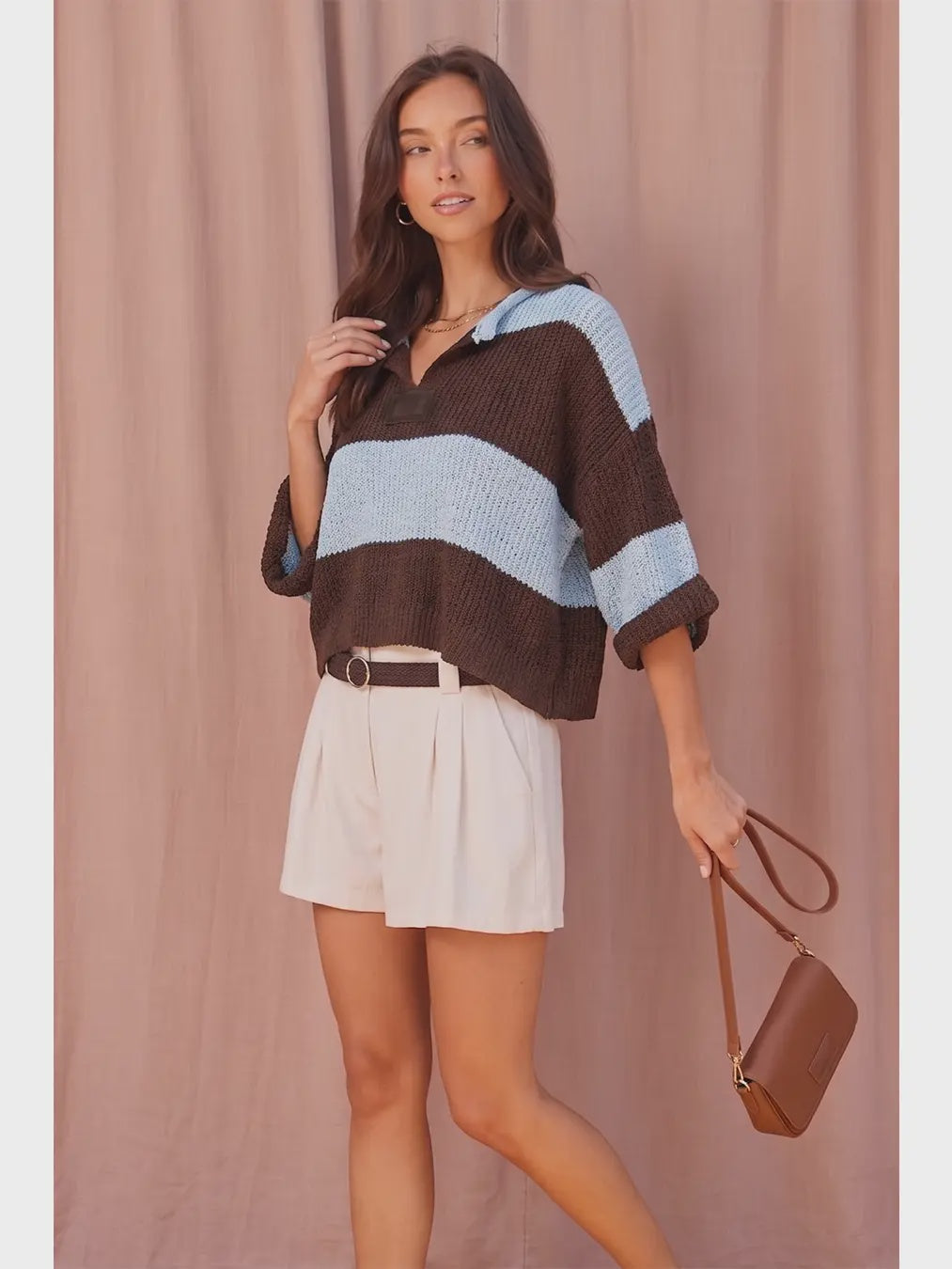 Women’s striped chunky knit sweater featuring a collared V-neckline, relaxed fit, dropped shoulders, and short wide sleeves.