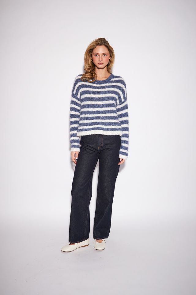 Relaxed crewneck sweater featuring bold horizontal stripes in a soft, substantial knit made from recycled polyester, nylon, wool, and spandex.
