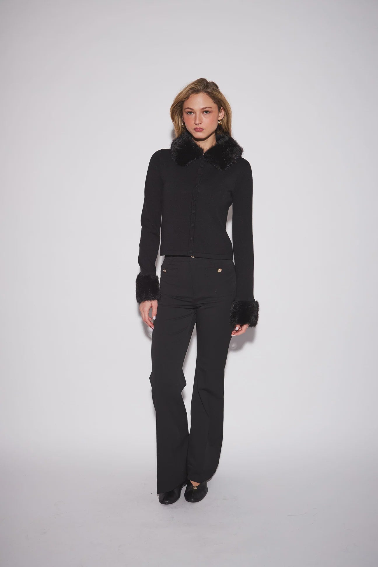 Clementine Cardigan featuring a fitted silhouette, textured knit, button-front closure, and removable faux fur trim at the collar and long sleeve cuffs.