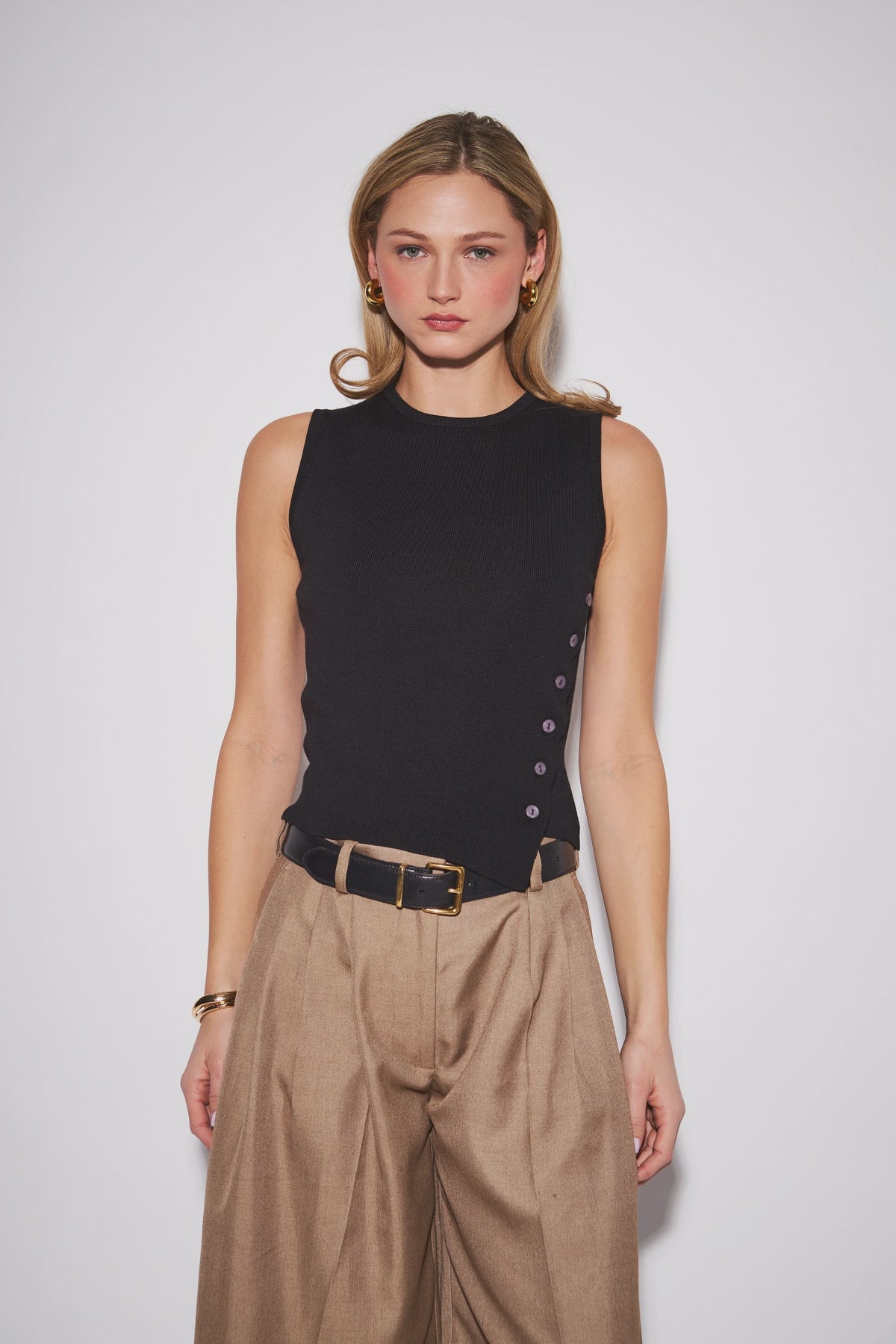 Nellie Top featuring a sleek sleeveless knit design with a clean, close-to-the-body silhouette, perfect for wearing alone or layering.