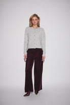 John & Jenn Sullivan Cardigan in Silver Bells featuring a classic crew neckline, button-front closure, long sleeves, and silver ball stud detailing throughout for a chic, polished look.