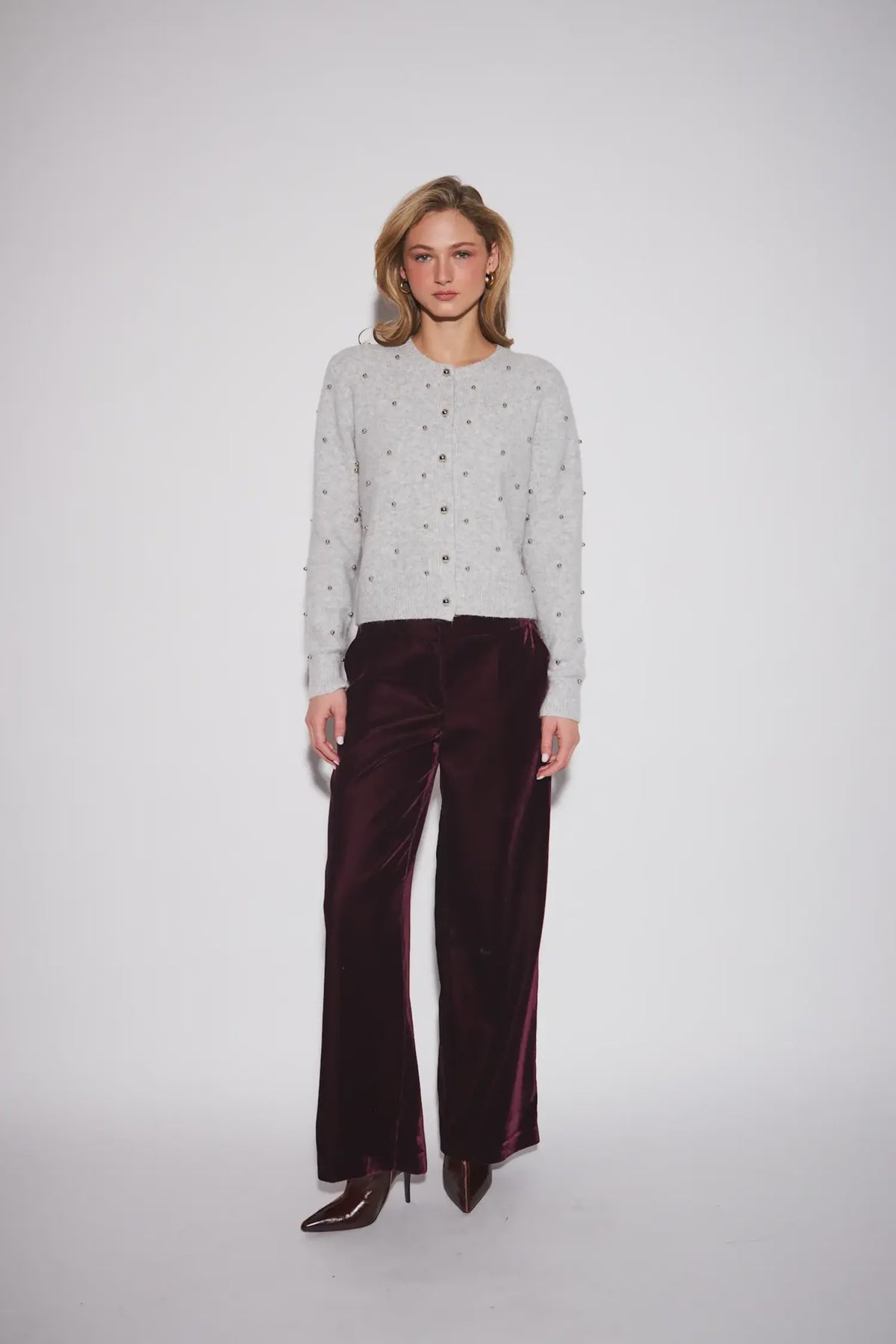 John & Jenn Sullivan Cardigan in Silver Bells featuring a classic crew neckline, button-front closure, long sleeves, and silver ball stud detailing throughout for a chic, polished look.