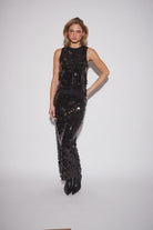 John & Jenn Cecily Top featuring a classic round neckline, sleeveless silhouette, and soft knit fabric with subtle shimmer for a chic, festive look.