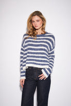 Relaxed crewneck sweater featuring bold horizontal stripes in a soft, substantial knit made from recycled polyester, nylon, wool, and spandex.

