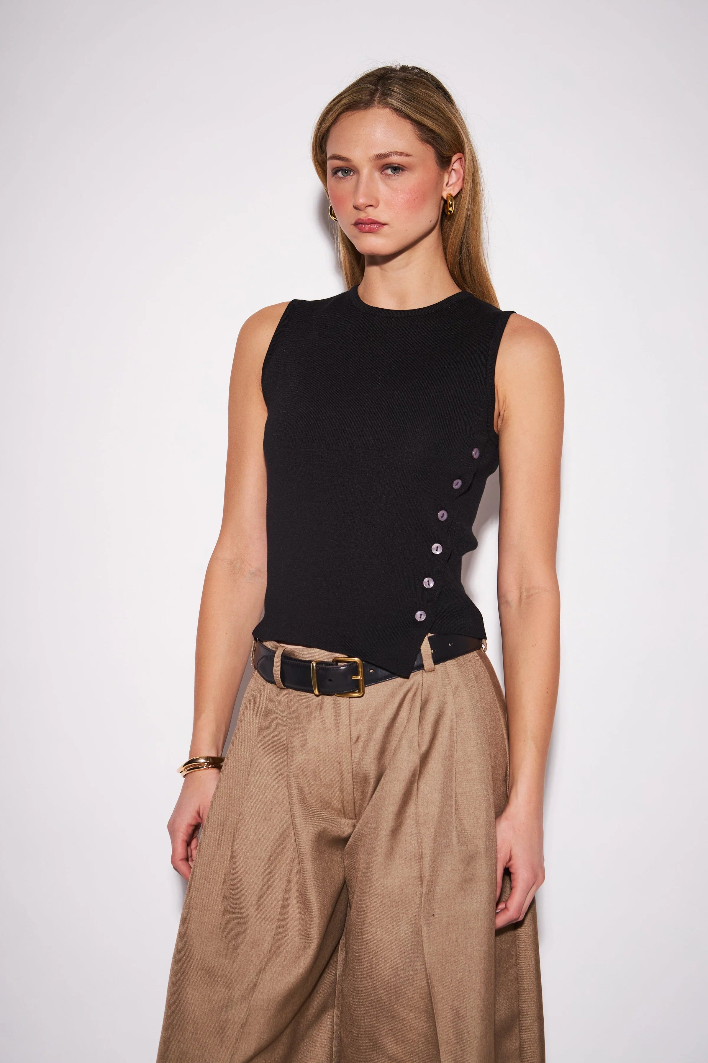 Nellie Top featuring a sleek sleeveless knit design with a clean, close-to-the-body silhouette, perfect for wearing alone or layering.